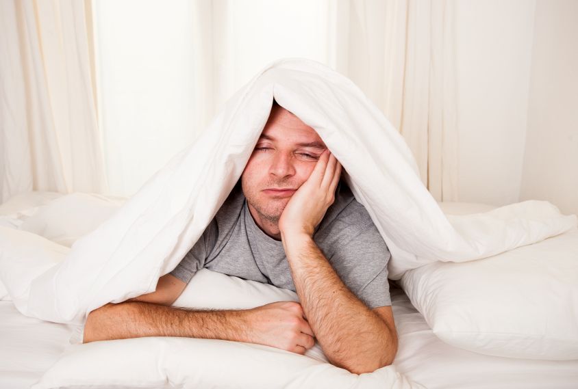 A tired man trying to take a nap